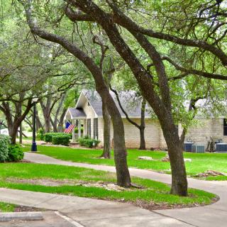 A serene suburban neighborhood with winding paths and abundant greenery.