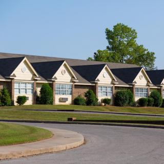 A row of well-maintained homes in a peaceful neighborhood.