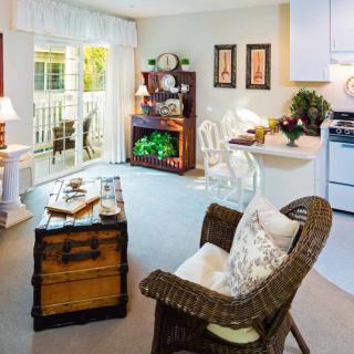 A cozy living room interior with elegant furniture and natural light.