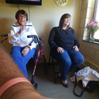Two women enjoying a moment together indoors.