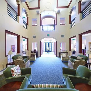 Spacious and well-lit lobby area with comfortable seating.