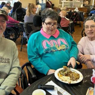 A group of people enjoying a meal together indoors.