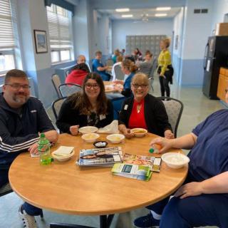 A group of people enjoying a meal together indoors.
