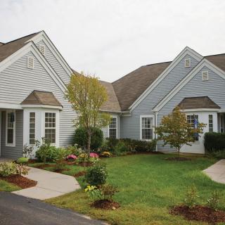 A suburban residential house with well-maintained landscaping.