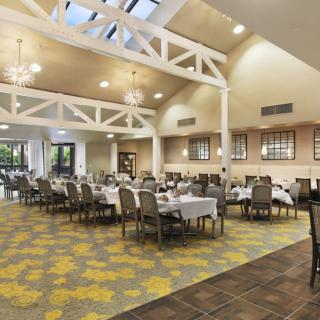 Spacious dining hall with elegant decor and ample seating.
