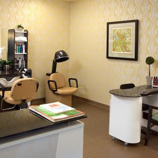 A cozy office space with salon chairs and decor.