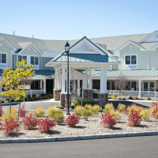 A modern building with well-maintained landscaping and a welcoming entrance.