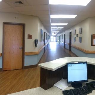 A view of a hospital corridor from the reception area.