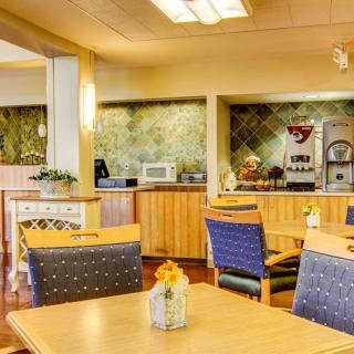 A cozy dining area with wood furniture and a relaxed atmosphere.