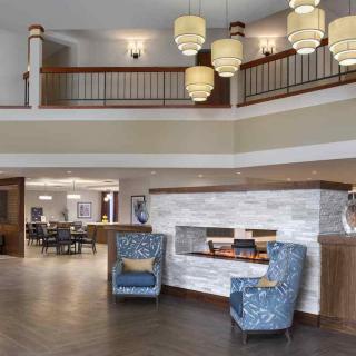 A modern lobby featuring stylish seating and elegant lighting.