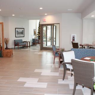 A spacious and inviting lobby area featuring modern furniture and ample natural light.