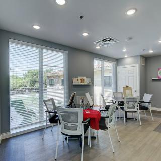 A modern meeting room with ample natural light and a sleek design.