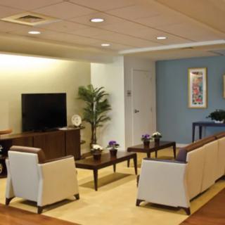A modern living room with comfortable seating and a television.