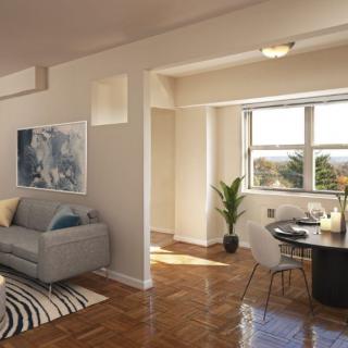 A cozy apartment living room with a dining area, featuring modern decor and ample natural light.