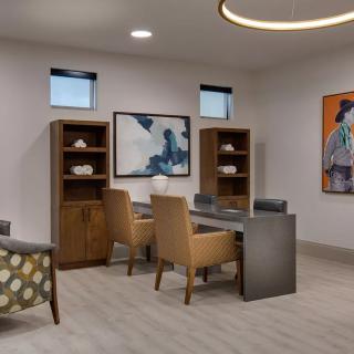 A modern office space featuring stylish furniture and contemporary artwork.