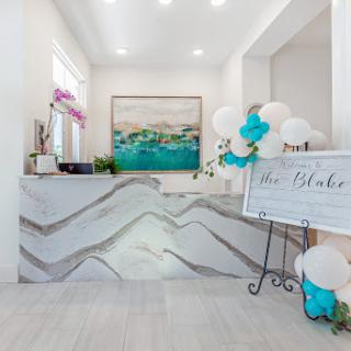 A beautifully designed reception area featuring modern decor and vibrant artwork.