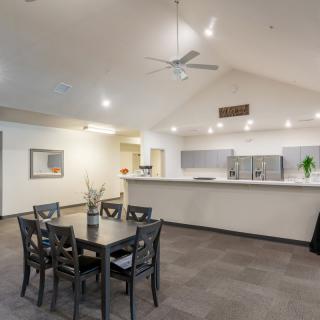A modern dining and kitchen area with elegant furniture and interior design.