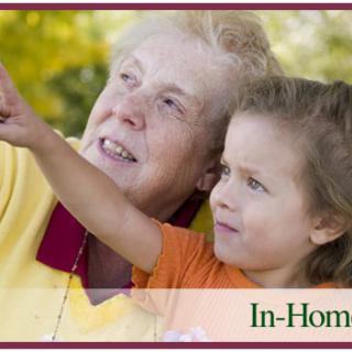 An elderly woman and a young child enjoying time outdoors together.