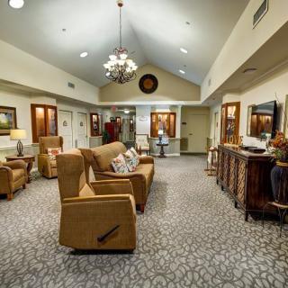 A cozy living room with comfortable seating and elegant decor.