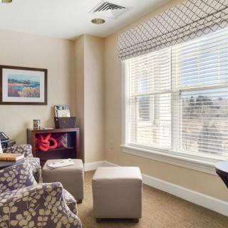 A cozy living room with modern decor and ample natural light.