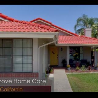 A cozy suburban house with a red-tiled roof and well-maintained front yard in California.