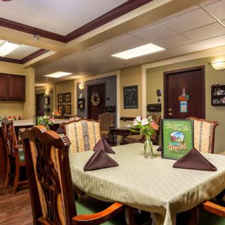 A cozy dining area with elegantly set tables in a restaurant.