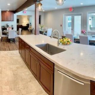 Modern kitchen with an open concept design and a central island sink.