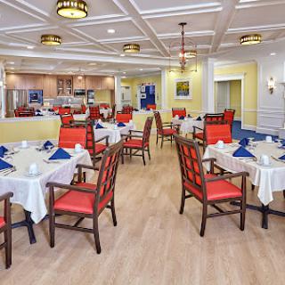 A bright and welcoming dining area with elegantly set tables.