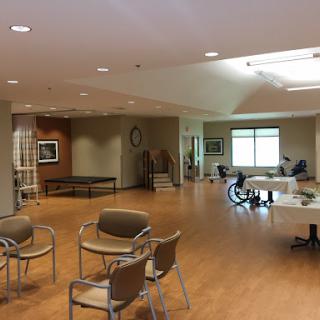A spacious and well-lit rehabilitation center waiting area, designed for comfort and accessibility.