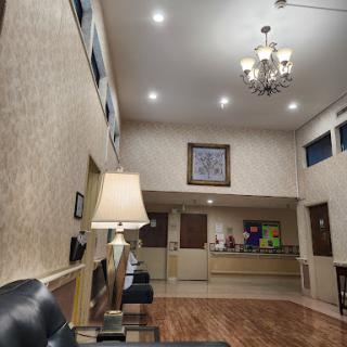 A cozy lobby with modern lighting and comfortable seating.