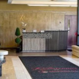 A stylish reception area with a modern desk and decorative elements.