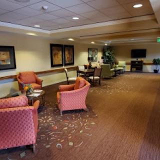 A cozy lobby area featuring comfortable seating and decorative elements.
