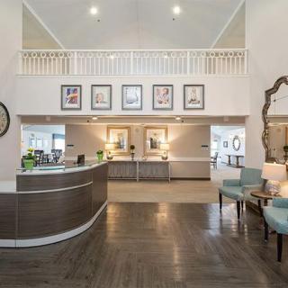 A modern and elegant lobby with a welcoming reception area and stylish decor.