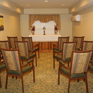 A well-arranged meeting room with chairs set up for an event.