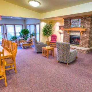 Cozy living room with a fireplace and comfortable seating area.