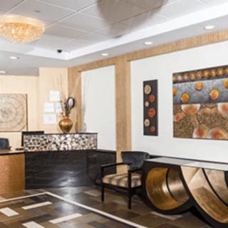 A modern reception area with stylish artwork and elegant furnishings.