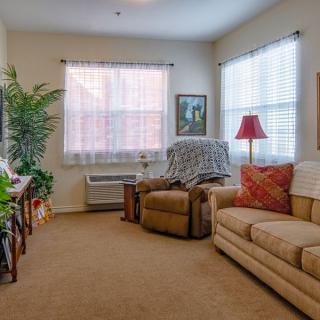A cozy living room with comfortable seating and soft lighting.