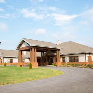 A welcoming community center with a spacious entryway and manicured lawns.