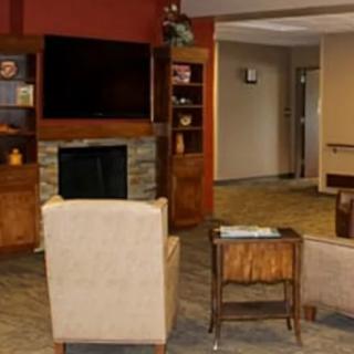 Cozy living room with a fireplace and comfortable seating arrangement.