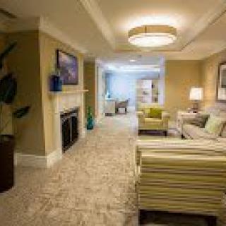 A cozy and modern living room interior with comfortable seating and warm lighting.