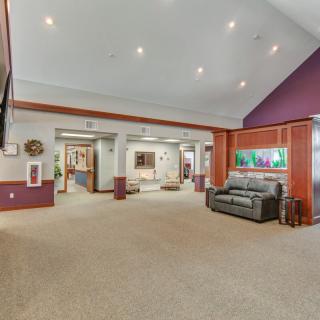 Spacious living room with modern decor and artwork.
