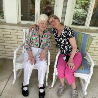 A moment of joy shared between two friends, enjoying a sunny day.