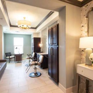 Modern salon interior with stylish furniture and elegant lighting.