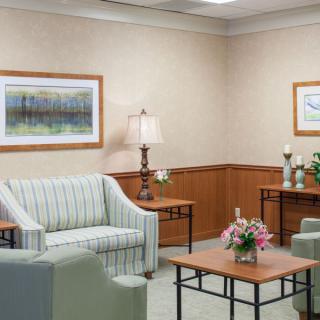 A cozy waiting room with comfortable seating and tasteful decor.
