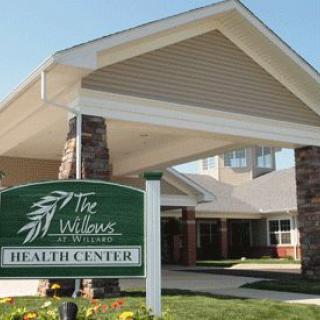Entrance of a healthcare center with visible signage.
