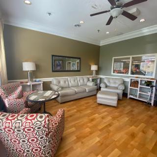 A cozy living room setup featuring comfortable seating and warm colors.