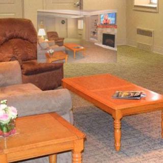 Cozy living room with comfortable seating and wooden tables.
