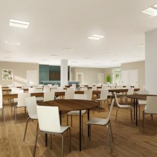 A modern cafeteria with wooden tables and white chairs, featuring bright lighting and a spacious layout.
