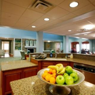 A modern kitchen interior featuring a fruit bowl on the countertop.