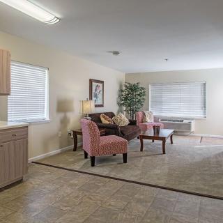 A cozy living room with comfortable seating and elegant decor.